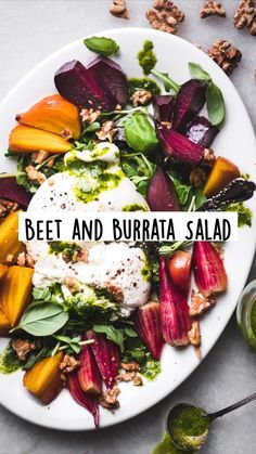 beet and burrata salad on a white plate with the words beet and burrata salad above it