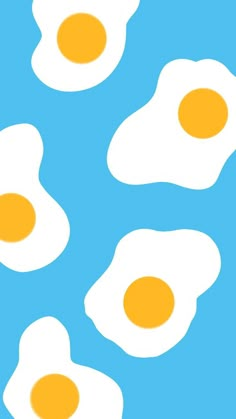 three fried eggs on a blue background