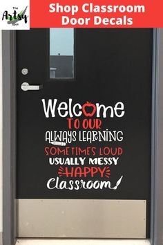 a black door with the words welcome to our class on it and an image of a classroom