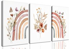 three canvases with flowers and butterflies on them, one has a rainbow painted on it