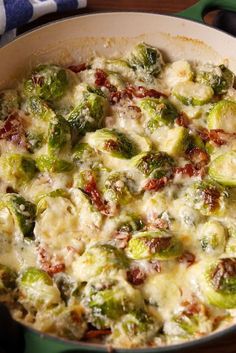 a casserole dish with brussel sprouts and tomatoes