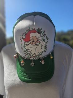 The cutest Santa hat for the holiday season!  hat for the holidays. Perfect for holiday shopping, holiday parties, and just every day wear! Get yours today, limited quantities available! ! *Several colors available, custom made to order. *Your choice of chain, 5 random charms included. White Christmas Hat As Gift, Adjustable Christmas Hat As Gift, Green Hat One Size Fits Most As Gift, Green Snapback Trucker Hat As Gift, Fun Green Hat For Gift, Fun Mini Cap Hats For Gifts, Adjustable Green Hats As Gifts, Adjustable Green Hat As A Gift, Adjustable Green Hat As Gift