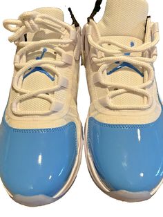 You are looking at a great item. Nike Air Jordan 11 CMFT Low White University Blue Back DN4180-114 Men's Size 8 Elevate your sneaker game with the Nike Air Jordan 11 CMFT Low White University Blue Back DN4180-114 in size 8. These sneakers are perfect for any occasion, whether it's for activewear or casual wear. The shoe features a lace-up closure and a low-top shoe shaft style. The upper material is made of patent leather, and the lining material is fabric. The sneaker has a cushioned, comfortable, and breathable design, making it perfect for any season. The outsole material is rubber, providing excellent traction and durability. These sneakers are part of the Air Jordan product line, which is known for its high-quality and stylish designs. The colorful and outdoor theme of these sneakers Nike Jordan Sports Shoes In Blue, Blue Jordan Shoes With Air Max Cushioning For Sports, Nike Jordan Blue Sports Shoes, Blue Nike Jordan Sports Shoes, Nike Jordan Shoes Blue For Sports, Jordan Synthetic Shoes With Air Cushioning For Sports, Blue Synthetic High-top Sneakers For Light Sports, Light Blue Synthetic Basketball Shoes With Round Toe, Light Blue High-top Sneakers With Cushioned Footbed For Sports