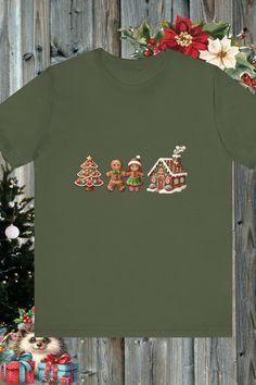 three gingerbread men's t - shirt in front of a christmas tree and presents