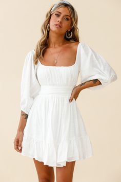 White dress  Off-shoulder style  Balloon sleeves  Gathered detailing in bust  Waist band  Tie-up back  Zipper in back   You'll be stealing hearts in our adorable Abby dress. We are obsessed with the off-shoulder style and super cute, tie-up back! Perfect for a girls' day out, getting matching manis and shopping 'til you drop. Team it with a cute head scarf, mules and a tote. Outfits Selfie, Confirmation Dresses, White Dresses Graduation, Cute White Dress, Selfie Leslie, Off Shoulder Fashion, Grad Dresses, Popular Outfits, Back Dress