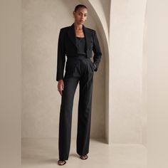 Wandering But Never Astray, The Lavish Heritage Explorer Pant Is Crafted For The Souls That Wish To Roam In Luxury With The Elevated Texture Of Italian Wool. Our Designers Added A Zip Fly, Making It Easier Than Ever To Seize The Day. Relaxed Fit: High Rise. Expertly Cut For A Loose Fit. Straight Leg. Extra Long - So You Can Wear Them With Heels. From Italy's Marzotto Mill: This Style Is Crafted Using 100% Virgin Wool From Italy's Marzotto Mill - One Of The Oldest Mills In Italy, Renowned For Cre Black Tailored Wide-leg Pantsuit, Elegant High Waist Workwear Sets, Elegant High-waist Workwear Sets, Chic Black Wide Leg Suit, Chic Black Wide-leg Suit, Elegant High Waist Black Sets, Black Fitted Wide-leg Pantsuit, Black Fitted Pantsuit With Wide-leg Pants, Business Casual Trousers