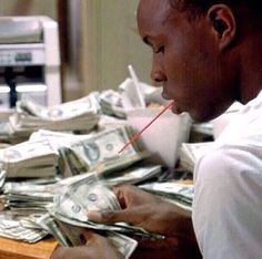 a man sitting at a table with money in front of him and the words mood