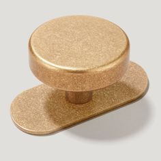 an image of a gold knob on a white background