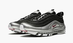 This Nike Air Max 97 offers a modified take on the Nike runner's original "Silver Bullet" Colorway with updated color blocking.  The upper sports black mesh with tonal overlays, while shiny metallic silver makes a statement towards the mudguard and sole.  Red branding hits the side panel, tongue, and heel tab.  As it’s done for over two decades, the Nike Air Max 97 hosts a foam sole with full-length Max Air cushioning. Red Branding, Nike Runners, Silver Bullet, Stadium Goods, Black Chrome, Nike Air Max 97, Black Mesh, Air Max Sneakers, Panel Siding