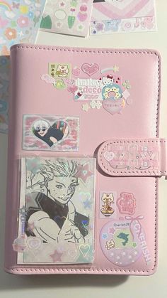 a pink wallet with stickers on it