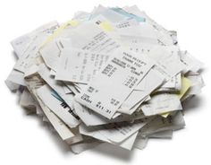 a pile of receipts sitting on top of each other