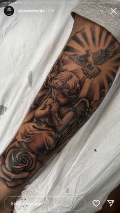 a man's arm with an angel and rose tattoo on it