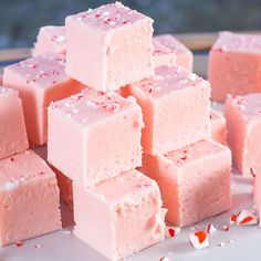 several pieces of pink fudge cake sitting on top of each other