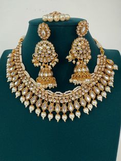 White Pearl Kundan Necklace Set with jhumka and Tikka  Arrives in a gift box! Stud Size:1.5 Inches Luxury Temple Jewelry Chandbali Bridal Sets, Luxury Gold-plated Kundan Necklace For Festivals, Luxury 22k Gold Kundan Necklace For Ceremonial Occasions, Luxury Temple Jewelry With Latkans, Luxury Jeweled Chandbali Temple Necklace, Luxury White Temple Jewelry Jhumkas, Luxury White Chandbalis For Festive Occasions, Luxury Traditional White Temple Necklace, Luxury Temple Jewelry Necklaces For Diwali