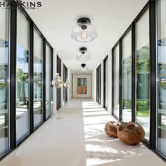 the hallway is lined with large glass windows