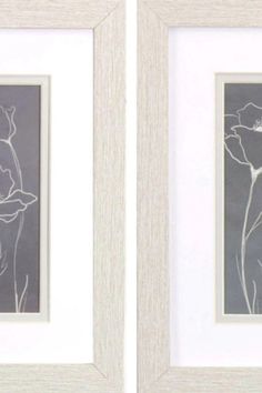 two framed pictures with flowers on them in white frames, one is gray and the other has