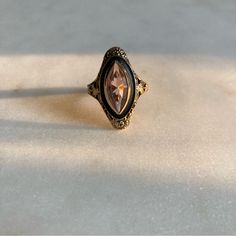 an antique ring with a large stone in the center