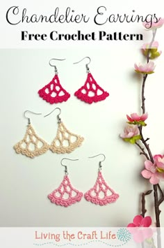 crochet earrings with pink and white lace hanging from hooks on a tree branch