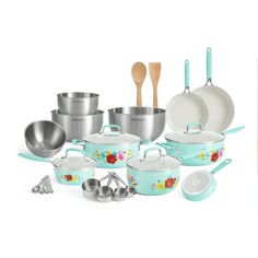 an assortment of pots and pans with wooden spoons next to each other on a white background