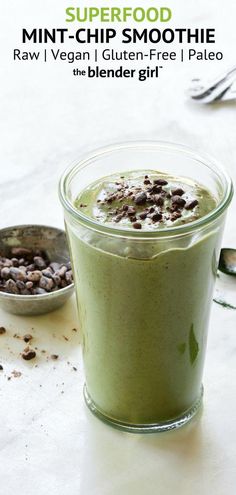 a green smoothie with chocolate chips in it