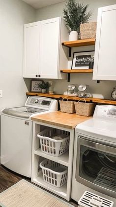 a washer and dryer in a small laundry room with open shelving on the wall