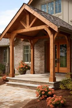 an outdoor covered patio with steps and flowers