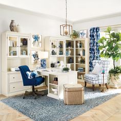 a living room filled with lots of furniture and decor on top of a hard wood floor