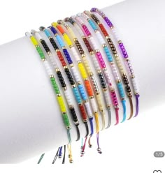 a stack of bracelets with different colored beads