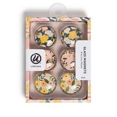 four floral cupcakes in a box