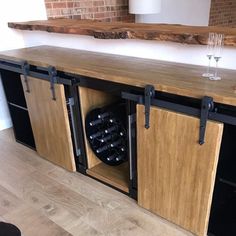 a wooden counter with wine glasses on it