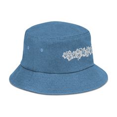 Inspired by the traditional flowers found all over Hawaii, this Hibiscus design bucket hat has everything you need to wander in style this season. Your friends eyes will pop out at the sight of it! Here’s an accessory that’ll become your main outfit piece. Get yourself this trendy, comfortable, and versatile bucket hat that'll work for all kinds of outfits—casual, sporty, and streetwear. • Made to order. • 100% cotton • 2 sewn eyelets on each side of the hat • Poplin sweatband • One size fits mo Summer Denim Blue Cotton Hat, Denim Blue Cotton Bucket Hat With Curved Brim, Summer Denim Bucket Hat With Curved Brim, Summer Denim Blue Bucket Hat With Curved Brim, Denim Blue Bucket Hat With Curved Brim For Summer, Denim Blue Curved Brim Bucket Hat For Summer, Denim Blue Bucket Hat For Spring, Brimmed Denim Blue Bucket Hat For Summer, Wide Brim Denim Blue Bucket Hat For Summer