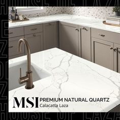 a kitchen with marble counter tops and gray cabinets is featured in the msi natural quartz catalog