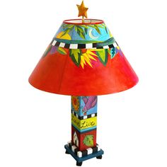 a colorful lamp with a red shade on it's base and a star on top