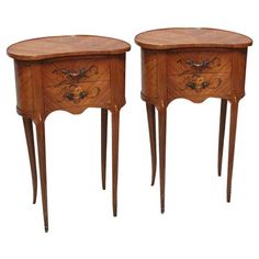 two small wooden tables with drawers on each side