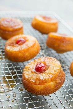 pineapple upside down cakes on a cooling rack