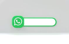 a green and white button on a gray wall with the text whatsapp?