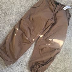 Brown Parachute Cargo Pants From Urban Outfitters. Size Xxs, Adjustable Waist And Ankle To Make It Wider Or Jogger. Brand New, Never Worn. Casual Straight Leg Cargo Pants By Urban Outfitters, Urban Outfitters Straight Leg Casual Cargo Pants, Urban Outfitters Casual Wide Leg Cargo Pants, Spring Cargo Pants From Urban Outfitters, Urban Outfitters Wide Leg Cargo Pants, Urban Outfitters Cargo Pants With Pockets For Spring, Urban Outfitters Spring Cargo Pants With Pockets, Urban Outfitters Utility Cotton Bottoms, Urban Outfitters Wide-leg Cargo Pants