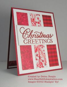 a christmas greeting card with red and white designs