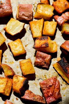 cooked potatoes and meat on a baking sheet