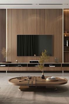 a living room filled with furniture and a flat screen tv on top of a wooden wall