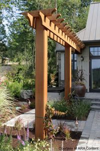 an outdoor patio with a pergolated trellis on the front and side of it