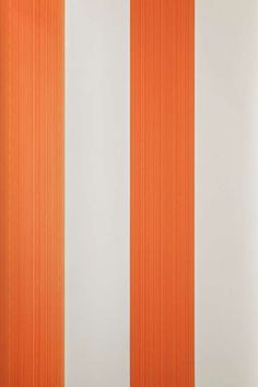 an orange and white wall with vertical stripes