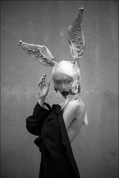 a woman with white hair and bunny ears on her head