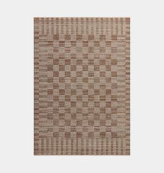 a brown and white rug with squares on it