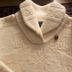 - Ralph Lauren - Vintage From The 70s - Exclusively Hand Knit For Lauren Ralph Lauren - Leather Button - Size Medium - Dry Clean Only!! - Reasonable Offers Only Otherwise I’ll Keep For Myself Message Me With Any Questions Cream Wool Sweater With Button Closure, Fitted Cream Sweater With Buttons, White Wool Sweater With Button Closure, Retro White Sweater With Buttons, White Retro Sweater With Buttons, Vintage Cream Sweater With Button Closure, Ralph Laurent, Sweaters Vintage, Ralph Lauren Leather