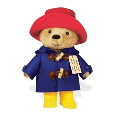 a teddy bear wearing a blue coat and yellow rubber boots with a tag on it