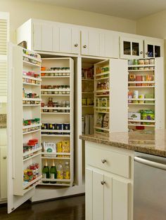 an open refrigerator in a kitchen next to a sink