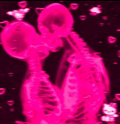 a skeleton kissing another skeleton in the dark