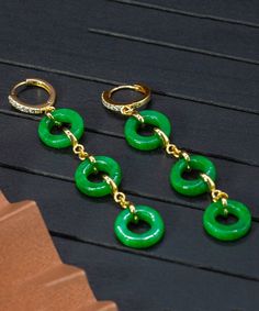 Indulge in timeless sophistication with our Vintage Green Jade Circle Drop Earrings. Crafted with sterling silver and overgilding, these earrings feature a beautiful jade circle design that exudes elegance and luxury. Elevate any outfit with these unique and exquisite earrings. Measurement: 7.5cm/2.925" * 1.5cm/0.585". Matches easily with daily hairstyle. dresses & Shirts Elegant Jade Hoop Earrings, Elegant Green Circular Earrings, Enamel Stud Earrings, Daily Hairstyles, Star Studs, Dress Jewelry, Circle Design, Turquoise Earrings, Ring Bracelet