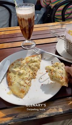 two slices of pizza on a white plate